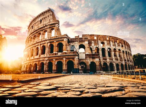 The ancient Colosseum in Rome at sunset Stock Photo - Alamy