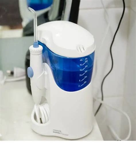 Should You Use A Waterpik Before Or After Brushing Teeth? - DentalsReview