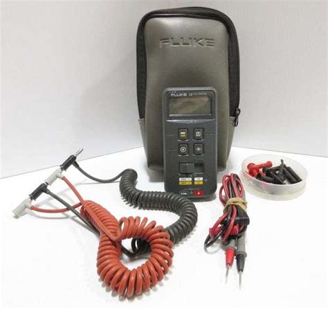 Fluke 12 multimeter with (2) sets of test leads, accessories, and new battery - Albrecht Auction ...