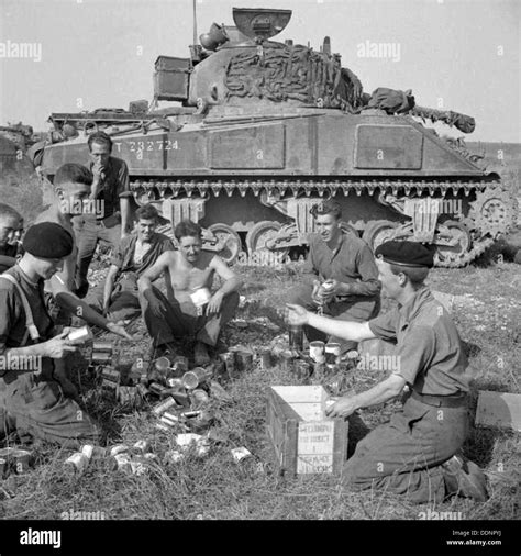 SHERMAN TANK crew of the 1st Northamptonshire Yeomanry enjoy their ...