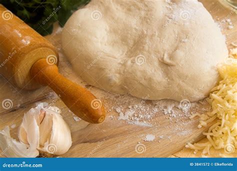 Pizza Dough and Rolling Pin Stock Photo - Image of board, natural: 3841572