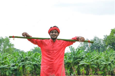 Premium Photo | Young indian farmer in a traditional costume on the field