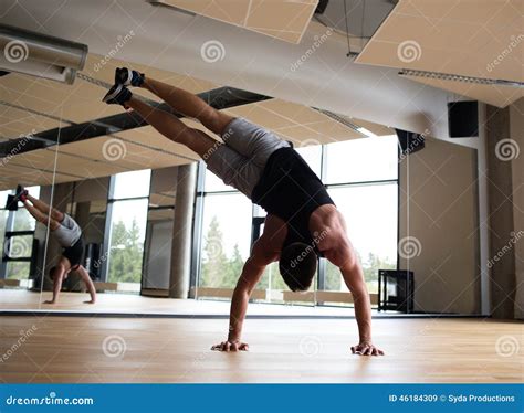 Man exercising in gym stock image. Image of athletic - 46184309