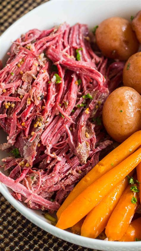 Tender Slow Cooker Corned Beef is the easiest recipes ever. All you have to do is add all the ...