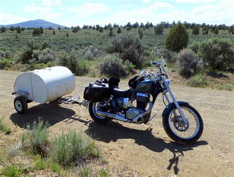 Tiny Motorcycle Camper Transforms From Storage Trailer To Teardrop-Like Sleep Space