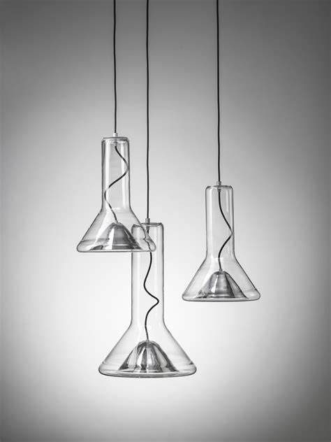 three glass lamps hanging from the ceiling