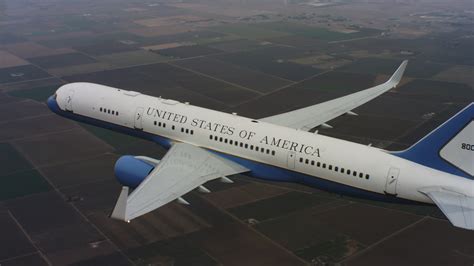 4K stock footage aerial video of a Boeing C-32 in the air above farmland in Northern California ...