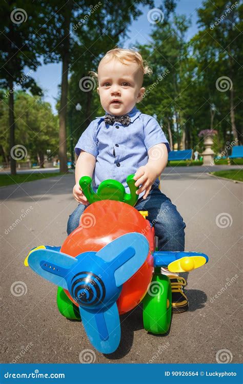 Happy Baby Driving Toy Car Stock Photography | CartoonDealer.com #90926564