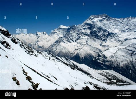 Snow covered high mountains of Annapurna II seen from Kang La Pass Nar ...