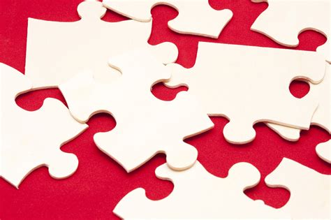 Free Stock Photo 10755 Scattered white jigsaw puzzle pieces | freeimageslive