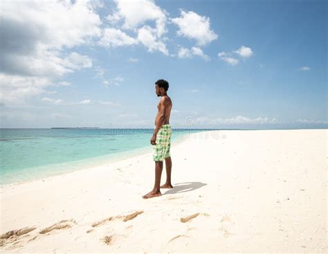 Black African Young Man Walking On Tropical Beach Stock Photo - Image ...