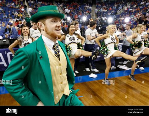 The Notre Dame mascot performs during the first half of an NCAA college basketball game against ...