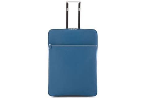 Roll through the airport in style with these 8 luxe luggage pieces