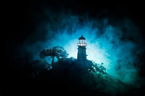 Lighthouse with Light Beam at Night with Fog. Old Lighthouse Standing ...