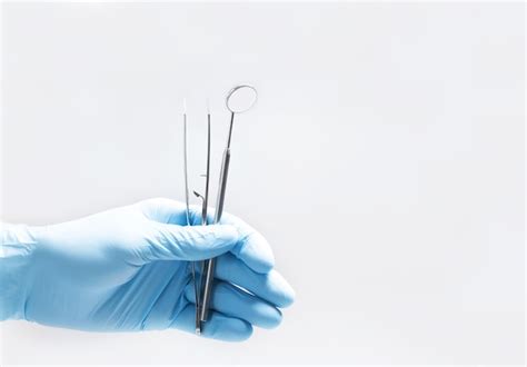 Premium Photo | Dental instruments on hand