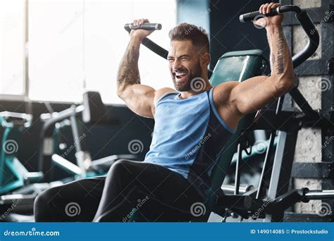 Handsome Muscular Man Working Out Hard at Gym Stock Image - Image of abdominal, handsome: 149014085