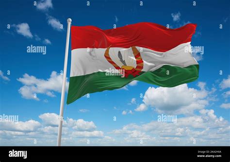 flag of Republic of Mahabad, asia at cloudy sky background, panoramic view. flag representing ...