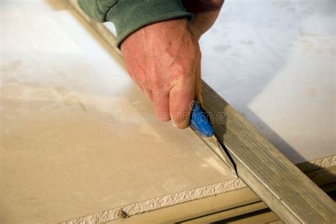 Cutting plasterboards stock image. Image of installation - 8018779