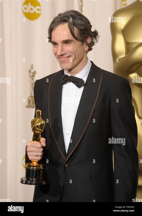 Actor Daniel Day-Lewis holds his Oscar for best actor for his work in ...