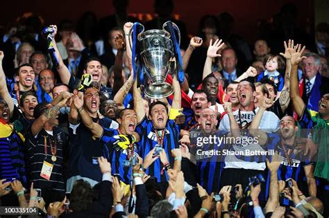 Javier Zanetti of Inter Milan lifts the UEFA Champions League trophy ...