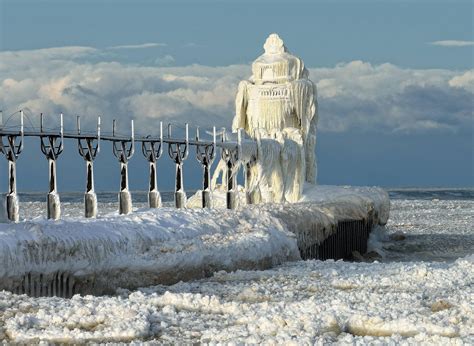 st joseph lighthouse covered in ice | Frozen St. Joseph North Pier ...