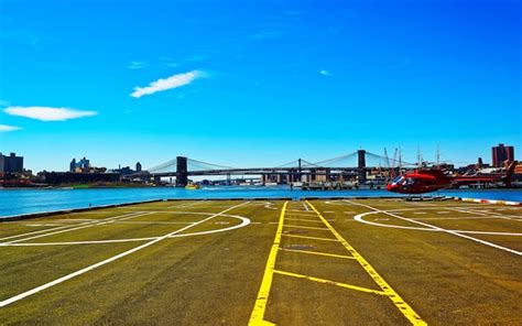 Premium Photo | Helicopter landing at helipad. skyline in lower ...