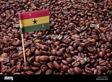 Flag of Ghana sticking in roasted coffee beans.(series Stock Photo - Alamy