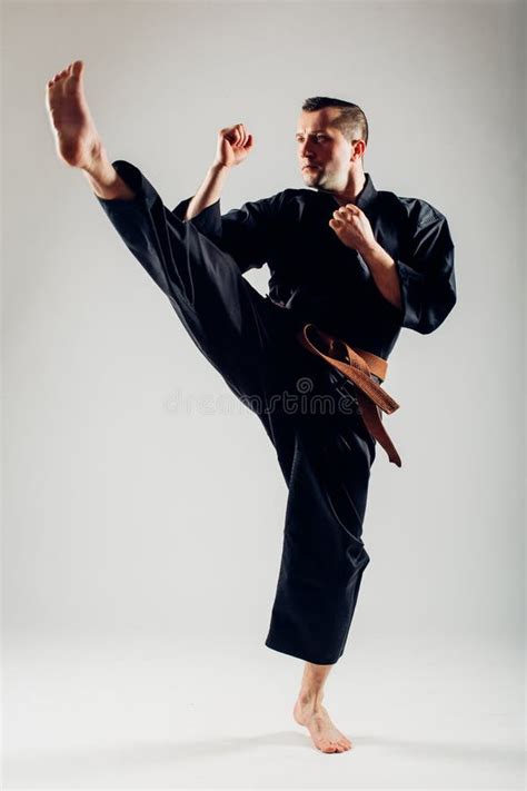 Young Male with Orange Belt Karate Fighter Training Stock Photo - Image of fist, pose: 65602942