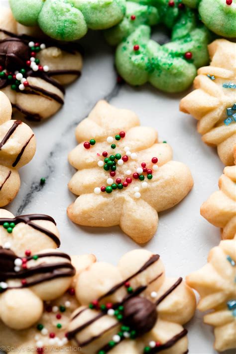 These are my favorite spritz cookies! Using a cookie press, shape this easy cookie dough into ...