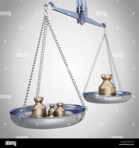 Silver weighing scale with golden weights Stock Photo - Alamy