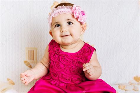 Cute baby girl in pink dress — Stock Photo © petrograd99 #22283953