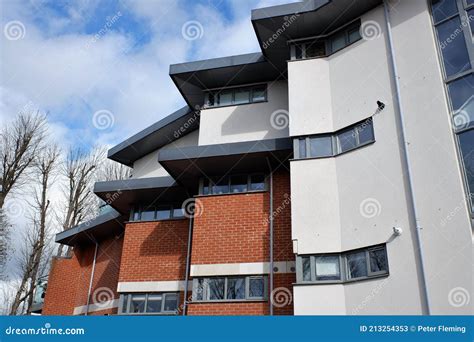 Contemporary Apartment Building with Staggered Wall Design in Town ...