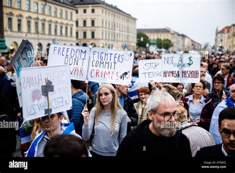 Munich, Germany. 09th Oct, 2023. Participants hold signs with ...