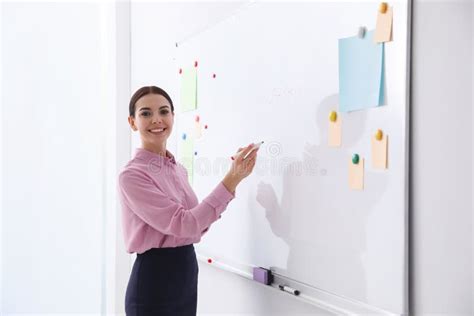 Young Teacher Writing on Whiteboard Stock Photo - Image of profession, indoors: 174038626