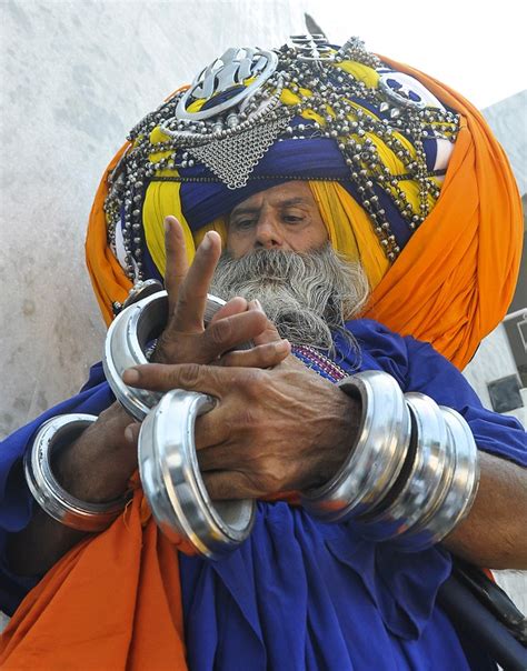 Devout Sikh wears the world's largest turban that takes six hours to ...