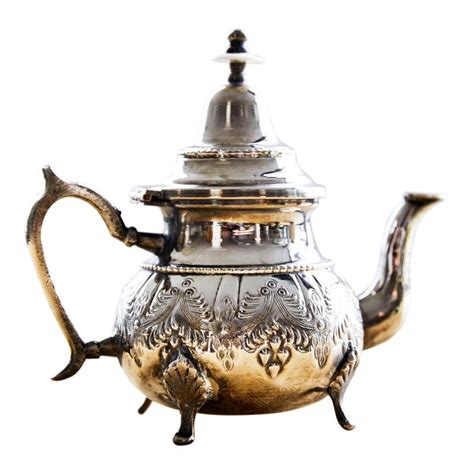 Elegant Moroccan tea pot. Silver plated, with hand-chased detailing throughout. From the ...