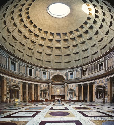 the interior of a large building with marble flooring and walls, looking up at a circular ceiling