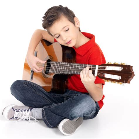 School Boy Is Playing The Acoustic Guitar Stock Photo - Image of male, guitar: 28485350