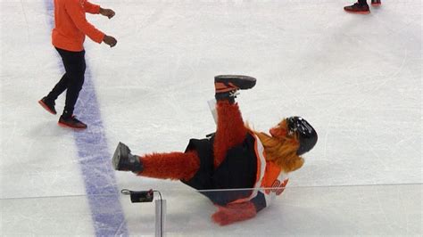 Flyers new mascot "Gritty" takes a spill on his first night - YouTube