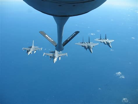 Two F-16Cs, a F-15E Strike Eagle(my brother), and a F-15C Eagle from the 85th TES in formation ...