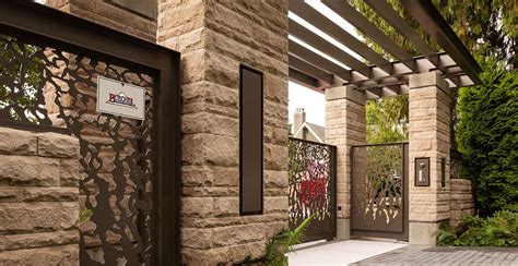 Modern exterior veneer stone home driveway gate design Rustic Buff ...