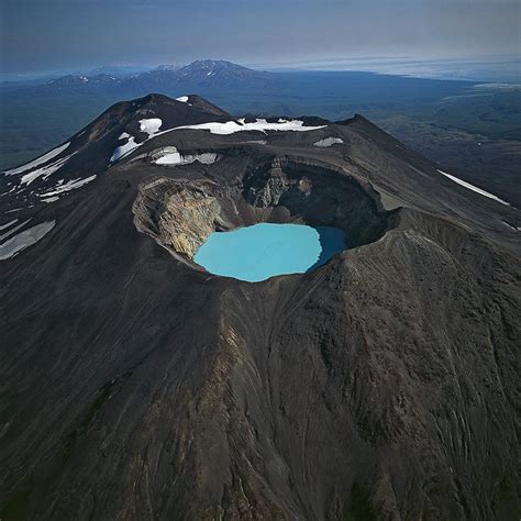 Karymsky Lake is a crater lake located in the Karymsky volcano in ...