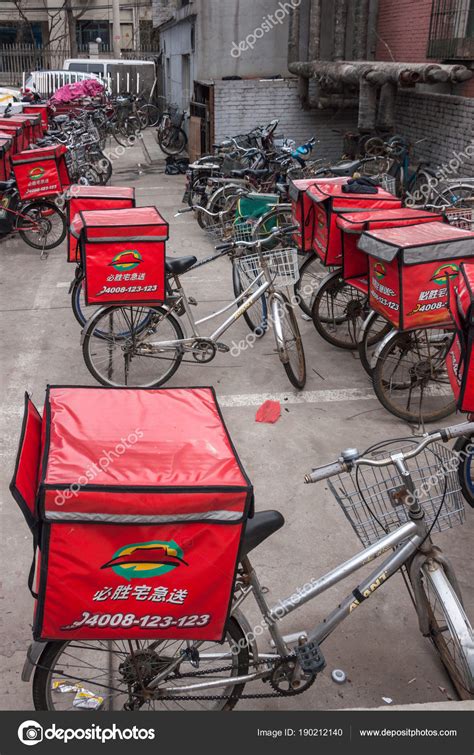 Pizza Hut delivery bicycles parked on courtyard, Beijing. – Stock ...