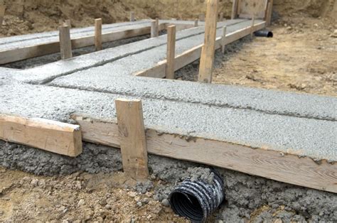 How to Pour Concrete Footings for Stone Walls