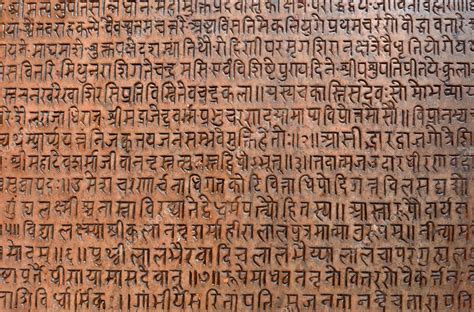 Background with ancient sanskrit text etched into a stone tablet Stock Photo by ©salajean 34791633