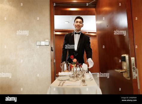 The hotel waiter Stock Photo - Alamy