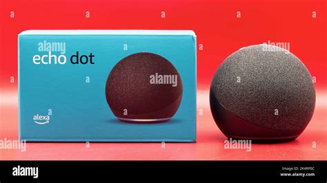 Amazon Echo Dot. Alexa, virtual assistant AI. Red background Stock Photo - Alamy