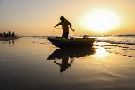 Fisherman Prepares Go Fishing On Beach Editorial Stock Photo - Stock ...