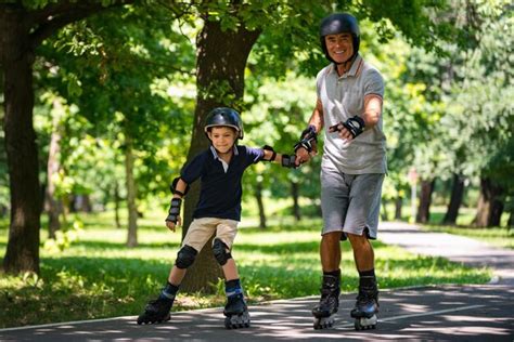 Premium Photo | Grandfather and grandson enjoying roller skating