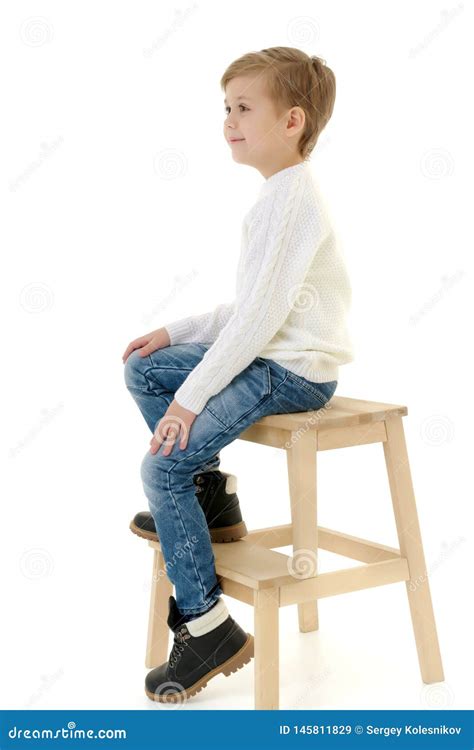 A Little Boy is Sitting on a Chair. Stock Image - Image of comfortable, fresh: 145811829